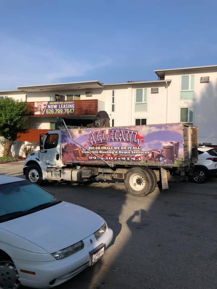 All Haul truck parked outside an apartment complex