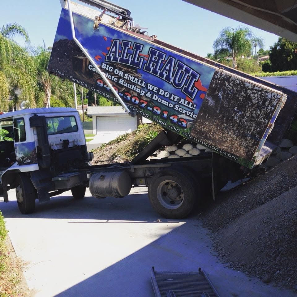 All Haul truck tilting its bed to unload debris